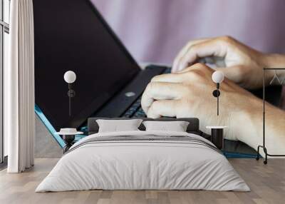 Close-up shot of two male hands working at home with laptop and mobile smart phone, network technology, no thumbs up, great working. Wall mural