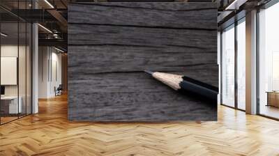 Closeup back pencil isolated on wood table background. Wall mural