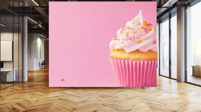 Butter cupcake muffin adorned with colorful sprinkles, set against a vibrant backdrop, showcasing a delightful treat perfect for celebrations. Wall mural