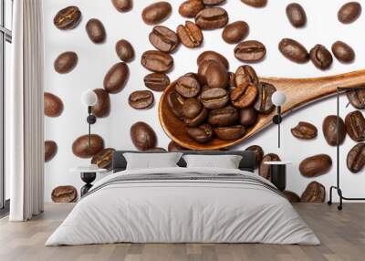 Close up coffee beans in wooden spoon isolated on a white background. Wall mural