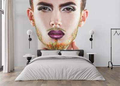 Charming male model with makeup and multicolor beard Wall mural