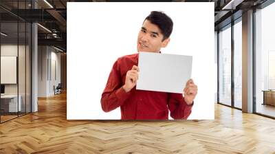 portrait of fashionable young man in red t-shirt with empty placard in his hands isolated on white background Wall mural