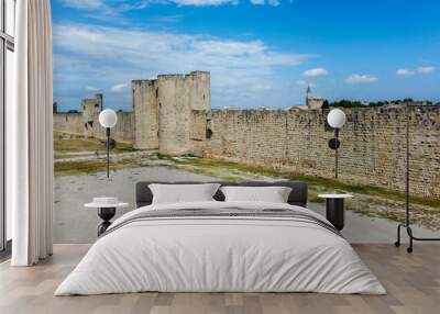 Fortified city of Aigues-Mortes, in Provence in France. Entirely surrounded by an imposing city wall and purple salt pans of incredible beauty, Aigues-Mortes is a jewel, an enchanting medieval village Wall mural