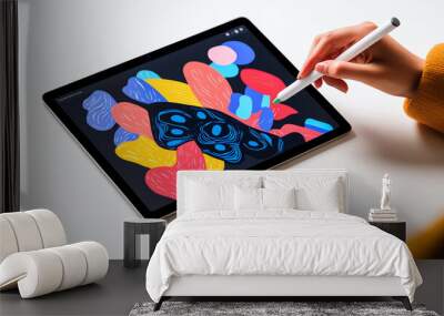 Person creating digital art on a tablet, vibrant colors and designs. Wall mural