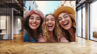 Three joyful female friends on holiday capturing self portraits in urban surroundings grinning at the lens Lovely young ladies relishing in technology, Generative AI Wall mural