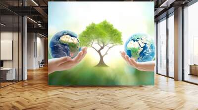 world environment and earth day, two human hands holding big tree and earth globe over green and blu Wall mural