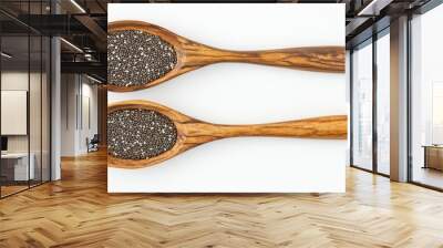 A spoonful of chia seeds is shown on a white background Wall mural