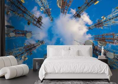 mobile phone communication antenna tower with cloud on center blue sky. Wall mural