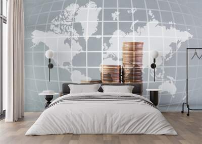 Savings, increasing columns of coins, piles of coins arranged as a graph, world map, global network business banking concept idea, element by NASA. Wall mural