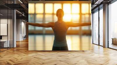 Woman in Silhouette with Arms Outstretched Towards Sunset Fitness Wellness Strength Po Wall mural