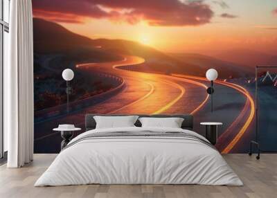 Scenic highway at sunrise with empty roads winding through green countryside and stunning sky in the background. Wall mural