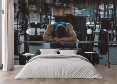 Overtraining. Male athlete suffering a headache or dizziness. Unmotivation in sport and tiredness concept.  Wall mural