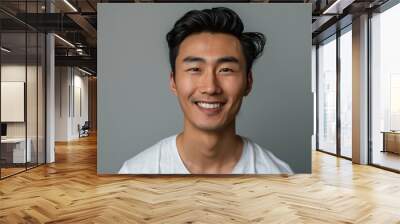 Asian Man Hair. Portrait of Confident Young Man with Happy Expression on Gray Background Wall mural