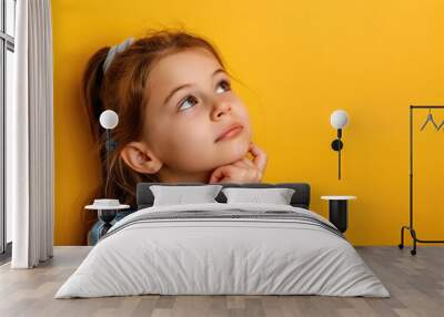 Thinking Unsure. Portrait of Pensive Young Girl Considering Invisible Option on Yellow Background Wall mural