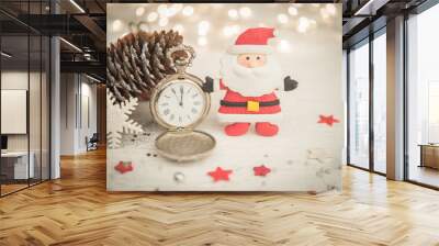 Ancient clock shows midnight eve and Santa Claus with stars and snowflake ornament fo Christmas Wall mural