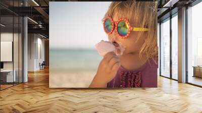 Girl eat icecream on summer holiday Wall mural