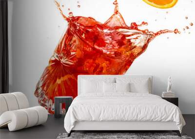 orange slice falling into a splashing negroni tilted on white background Wall mural