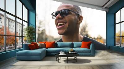 Mental health and happiness concept - African man enjoying first spring days. High quality photo Wall mural