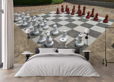 White and black chess pieces on chess board Wall mural