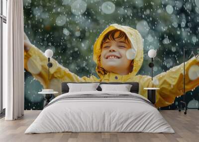 Boy in yellow raincoat, Child having fun on rainy Wall mural