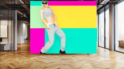 girl dancer on bright background. lifestyle, sports clothes, fas Wall mural