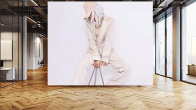 Urban Girl in studio. Trendy beige casual look. Denim Suit Jacket and Pants. Style in details. Fall winter season. White aesthetic Wall mural