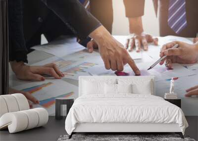 Close up shot business people team meeting in conference room in company. Businessman pointing pen at document on the table. Wall mural