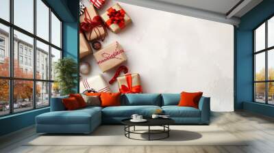 A festive Christmas background with wrapped gifts, ornaments, and a copy space on a white background. Wall mural