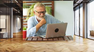 Portrait senior man using laptop for working at home, Freelance concept - Image Wall mural