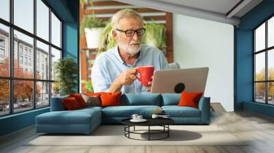 Portrait senior man using laptop for working at home, Freelance concept - Image Wall mural