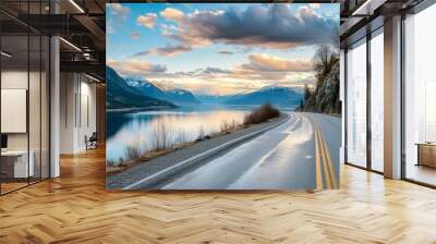 Imagine a road leading to a tranquil lakeside retreat, with the calm waters reflecting the surrounding mountains and sky Wall mural