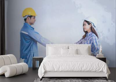 Engineering and worker with helmet handshake together to agree j Wall mural