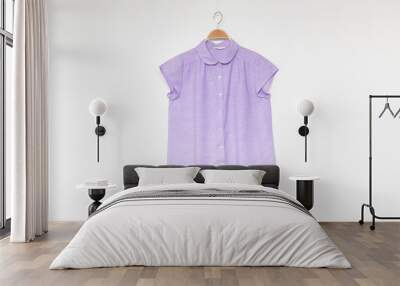 purple blouse with wooden hanger isolated white background. Wall mural