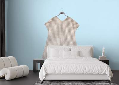 Woman blouse with blue blouse cotton on pastel background.   Wall mural