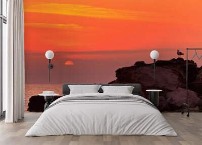 sunrise on a rocky shore Wall mural