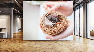 wedding rings of gold lie on the surface Wall mural