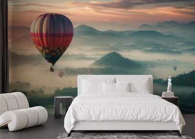 Hot Air Balloon Ascending Above Misty Mountains at Sunrise Wall mural