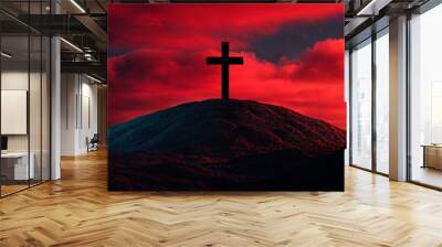  Black silhouette of a cross on top of a hill against a red sky background. Easter concept. Wall mural