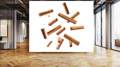 Falling cinnamon stick isolated on white background Wall mural