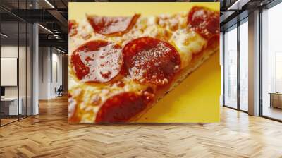 Close-up of pepperoni pizza slice with tangy sauce and gooey cheese on a vibrant background. Wall mural