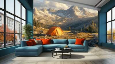 Mountain campsite in alpine meadow with snow-capped peaks, tent, hiking gear, morning sun. Wall mural