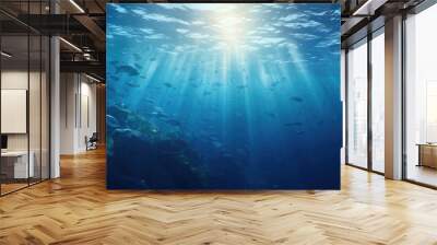 Sunlight piercing through marine depths with tropical fish. Underwater world. Wall mural