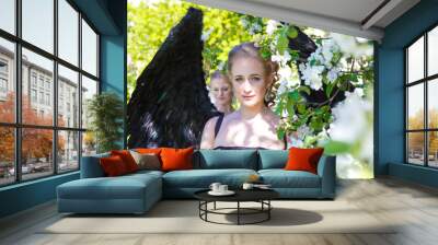 white and black angel.Two girl in suit of white and black angel. Wall mural