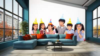 group of kids celebrate party and enjoy christmas fun together,Children are exchanging gifts. Wall mural