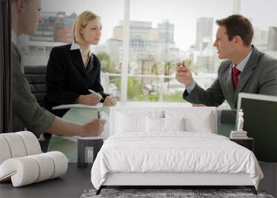 businessman convicing two women at a business meeting Wall mural