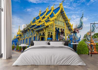 Wat Rong Sua Ten temple with blue sky background, Chiang Rai Province, Thailand, It's a popular destination and Landmark of Chiang Rai Wall mural