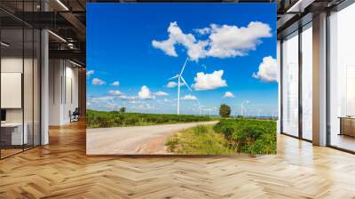 Wind turbine farm in beautiful nature with blue sky blackground, generating electricity in Nakorn Ratchasima Thailand Wall mural