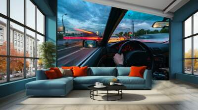 Movement of the car at night at high speed view from the interior with driver hands on wheel. Concept spped of life. Wall mural