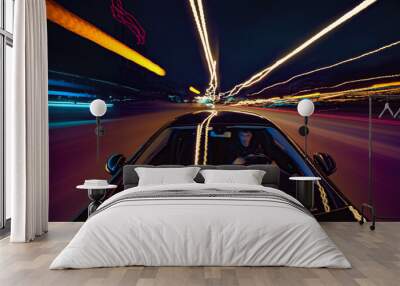 View from Front of Car moving in a night city, Blured road with lights with car on high speed. Wall mural