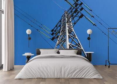 Metal electric pole on a blue sky background Wall mural